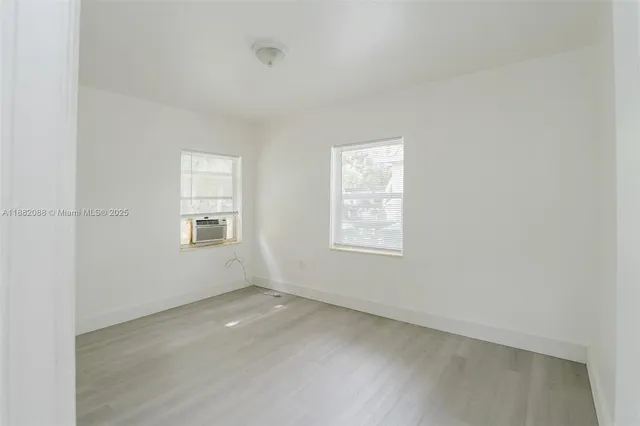 an empty room with windows