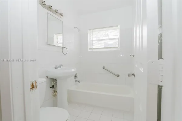a bathroom with a toilet and a bathtub