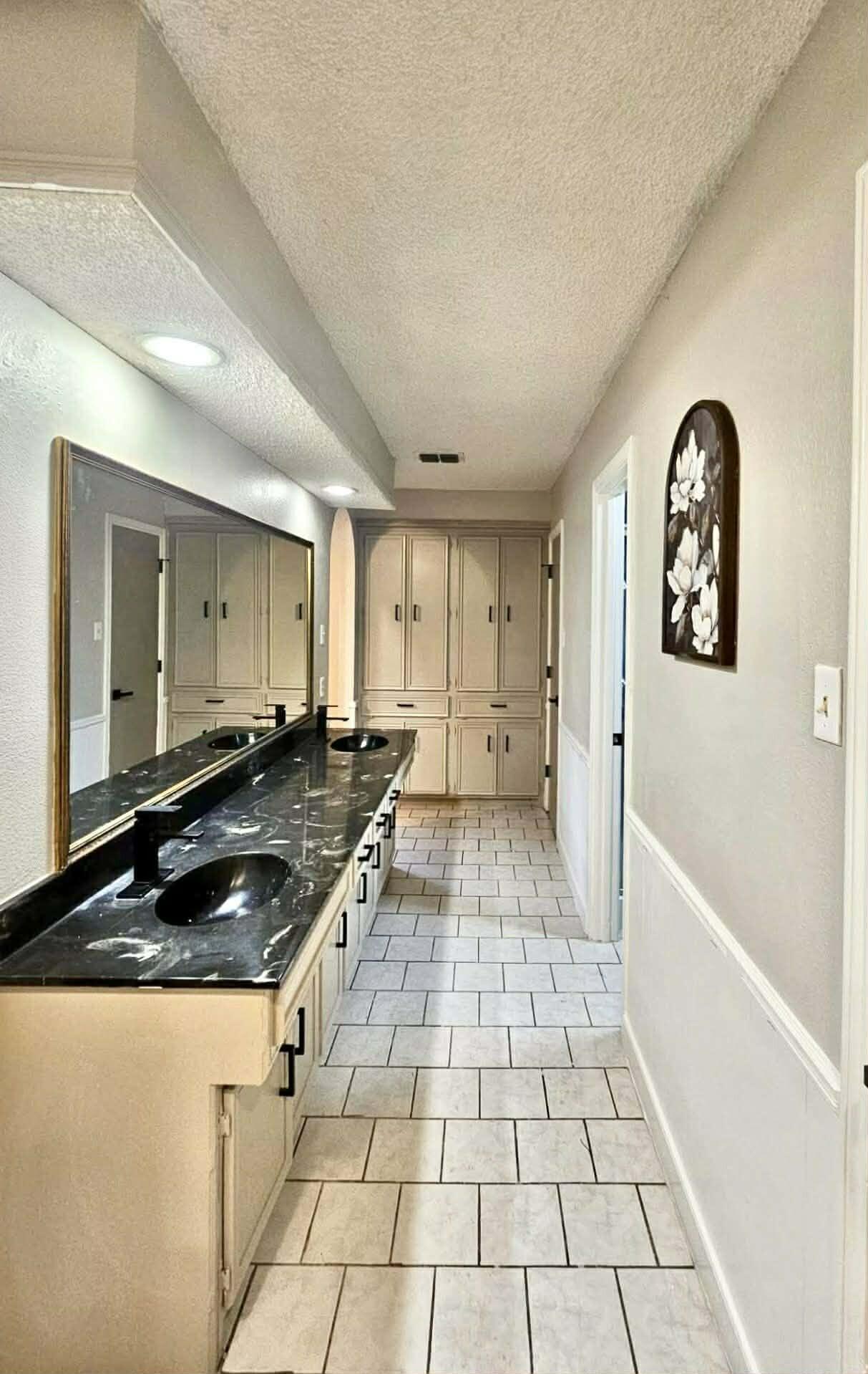 3710 75th Street Lubbock, TX 79423 - Photo 11 of 36 a kitchen with a sink and a stove top oven