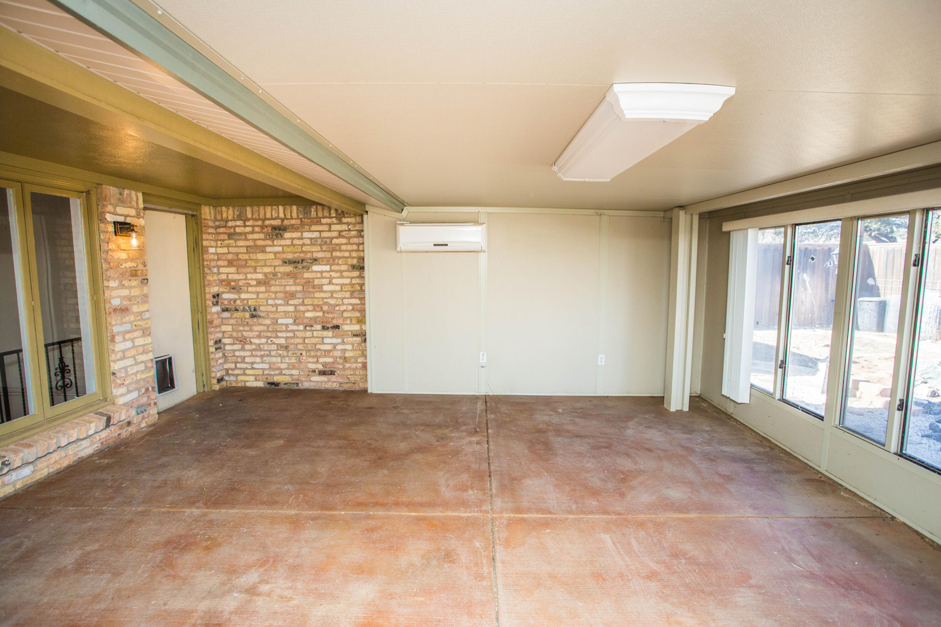 3710 75th Street Lubbock, TX 79423 - Photo 23 of 36 a view of an empty room with a window
