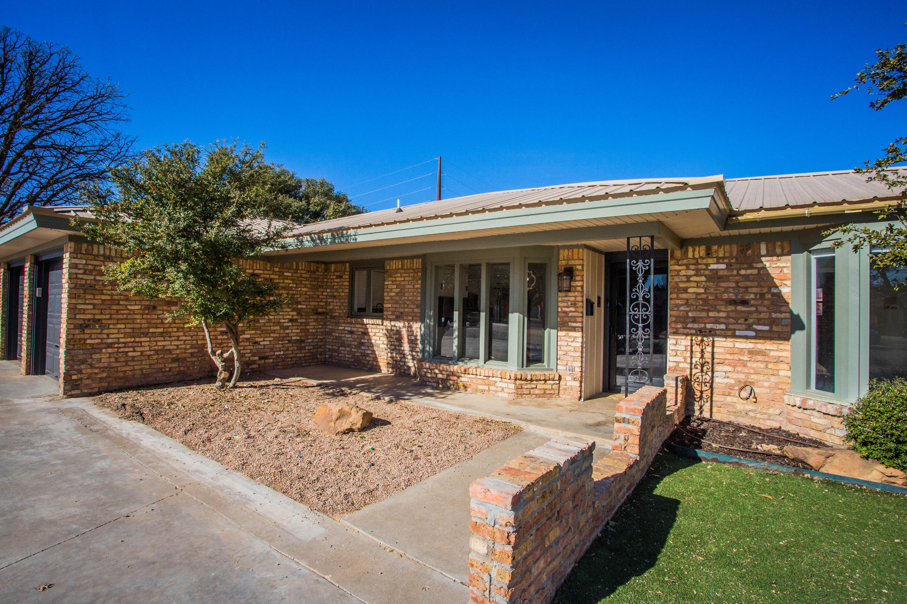 3710 75th Street Lubbock, TX 79423 - Photo 3 of 36 a view of a house with backyard porch and sitting area