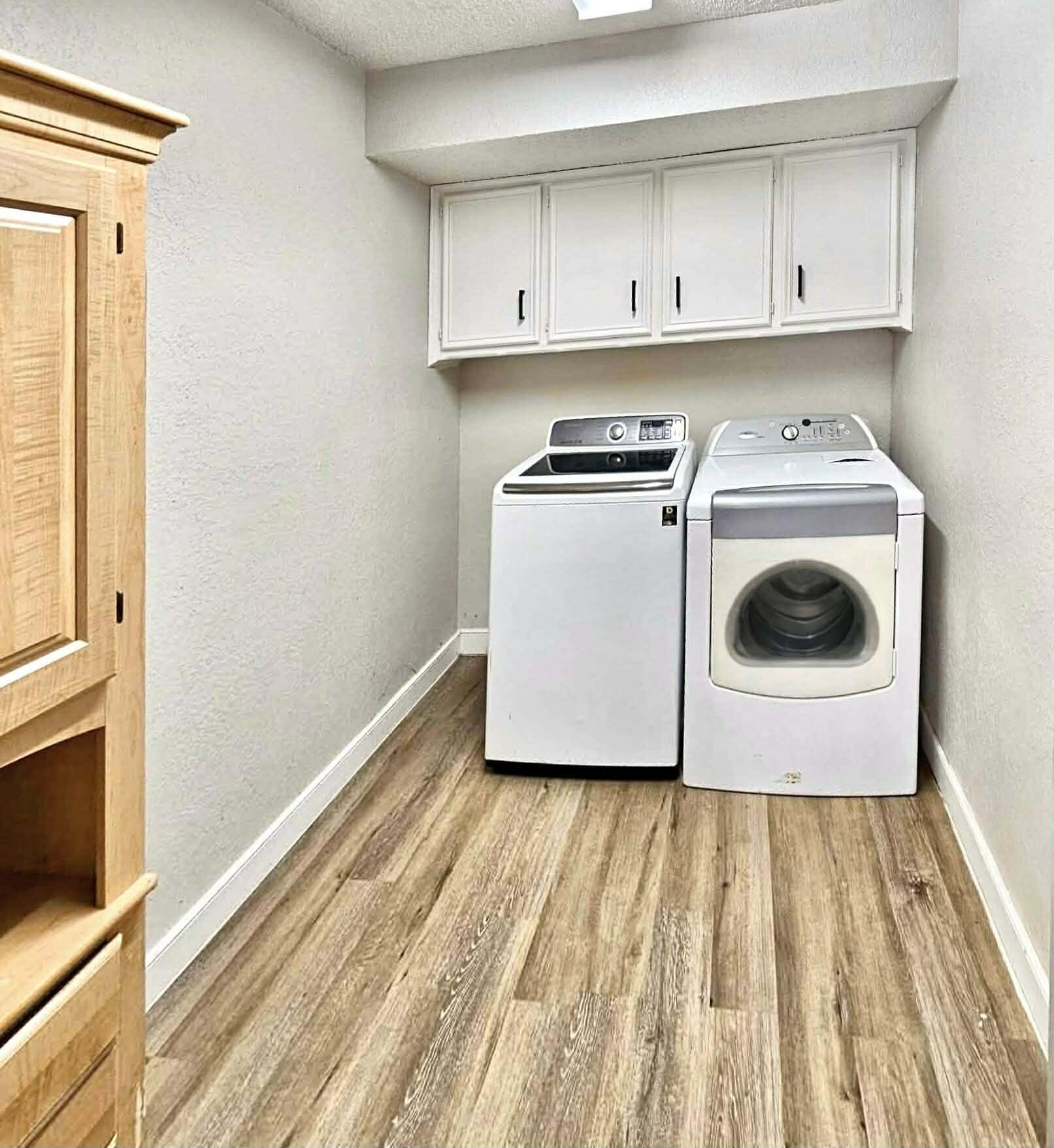 3710 75th Street Lubbock, TX 79423 - Photo 9 of 36 a room with wooden floor and cabinets
