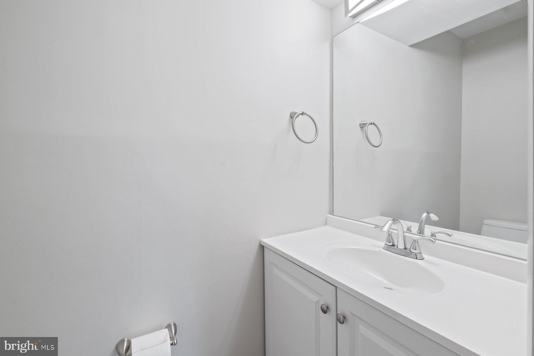 3030 Piano Lane, Unit 56 Silver Spring, MD 20904 - Photo 12 of 28 a bathroom with a sink and mirror