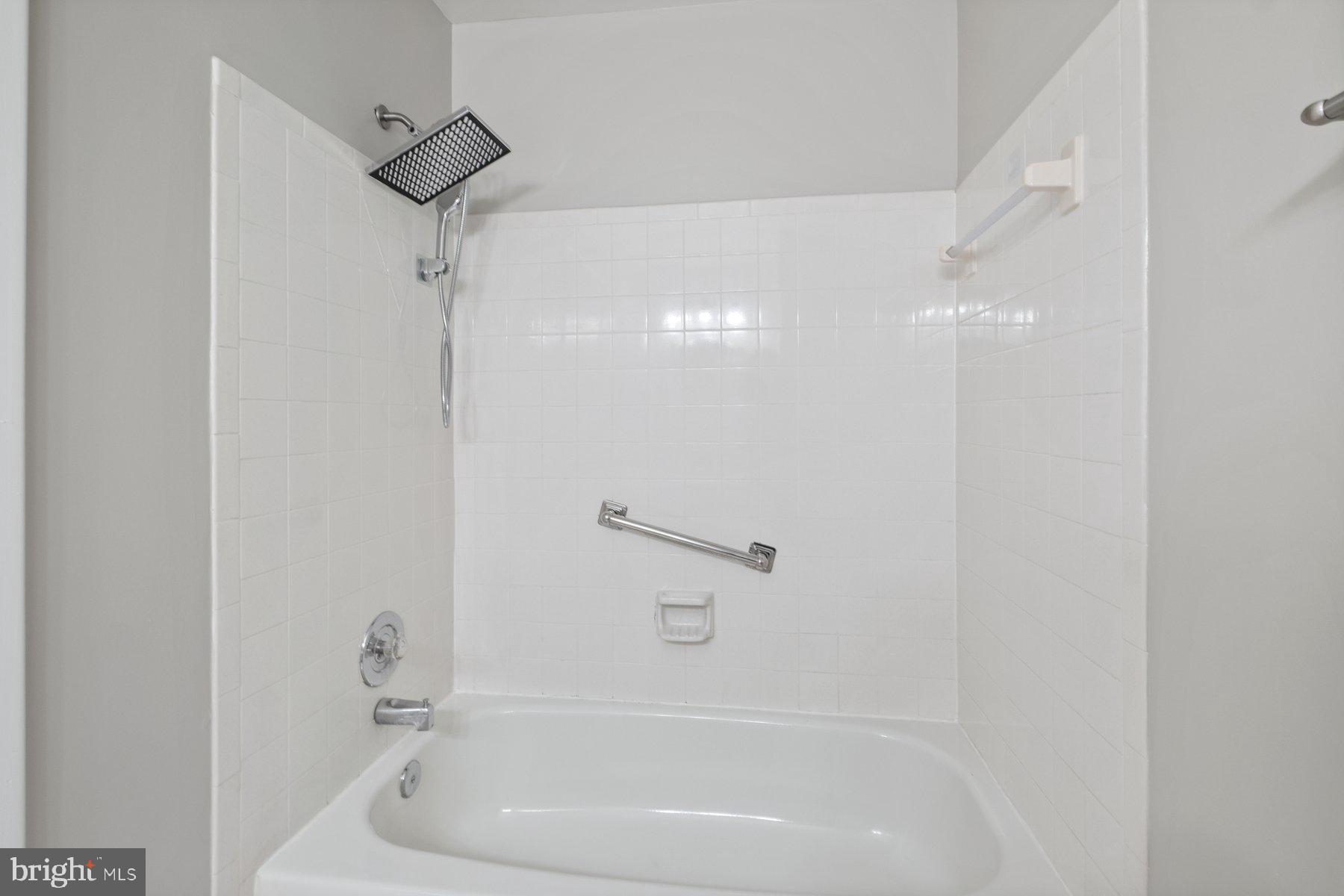 3030 Piano Lane, Unit 56 Silver Spring, MD 20904 - Photo 18 of 28 a bathroom with a bathtub