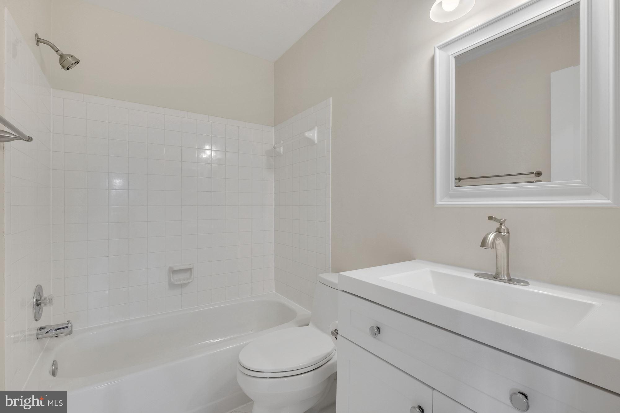 3030 Piano Lane, Unit 56 Silver Spring, MD 20904 - Photo 21 of 28 a bathroom with a sink a toilet and shower
