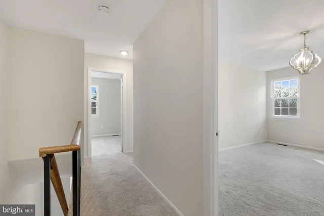 wooden floor in an empty room with a mirror
