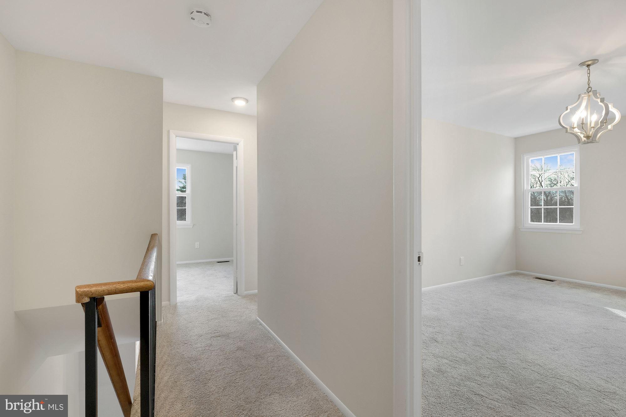 3030 Piano Lane, Unit 56 Silver Spring, MD 20904 - Photo 24 of 28 wooden floor in an empty room with a mirror