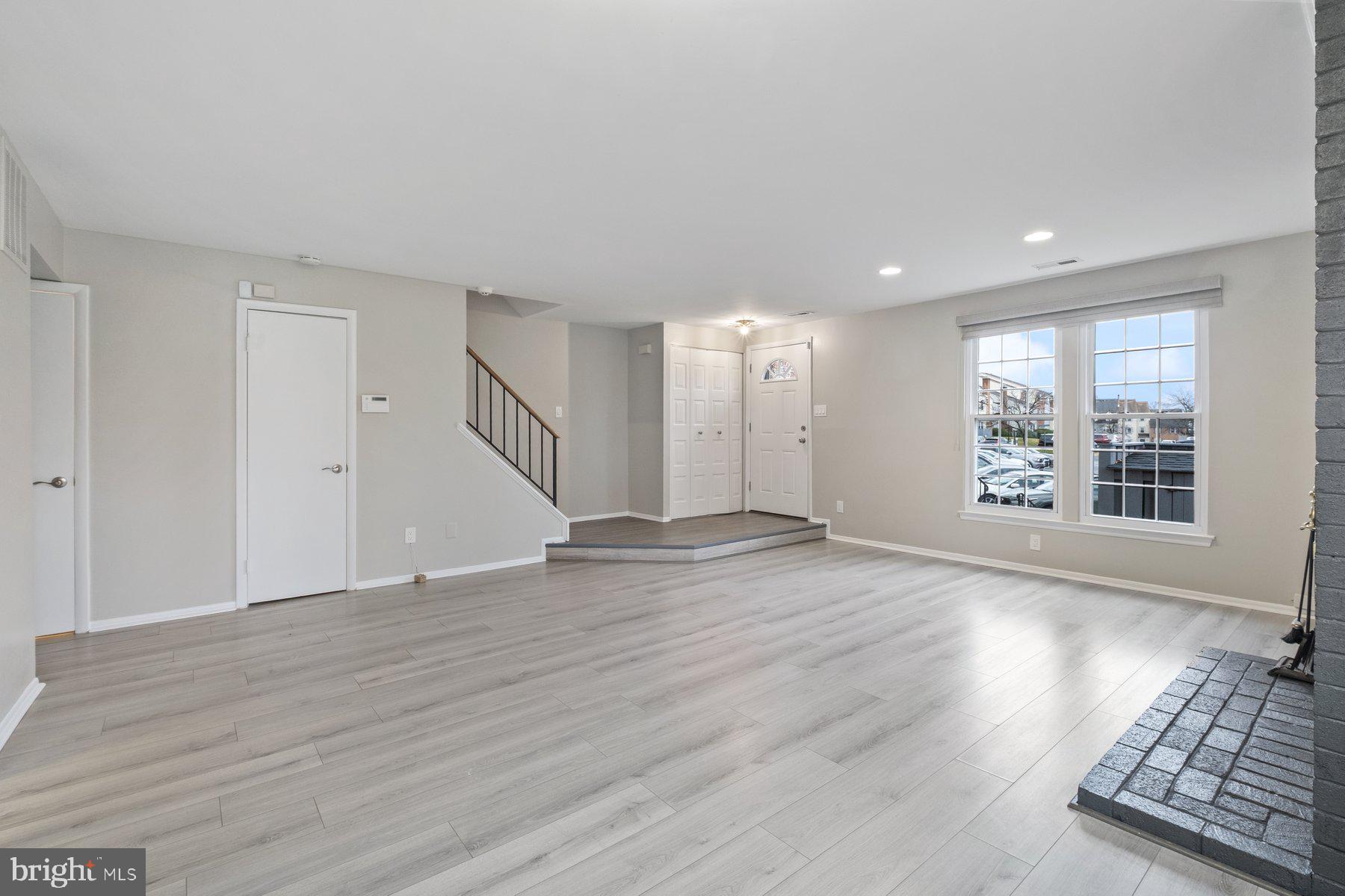 3030 Piano Lane, Unit 56 Silver Spring, MD 20904 - Photo 3 of 28 a view of an empty room with wooden floor and a window
