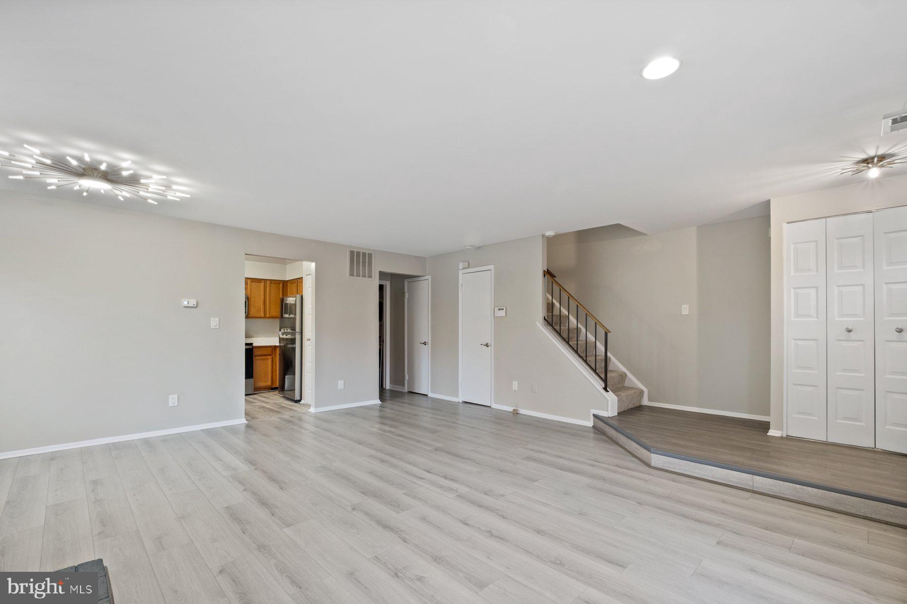 3030 Piano Lane, Unit 56 Silver Spring, MD 20904 - Photo 6 of 28 wooden floor in an empty room with a window