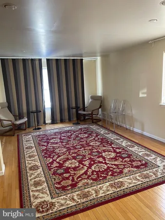 a kitchen with granite countertop a refrigerator and a sink