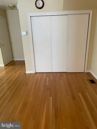 an empty room with a empty space and windows