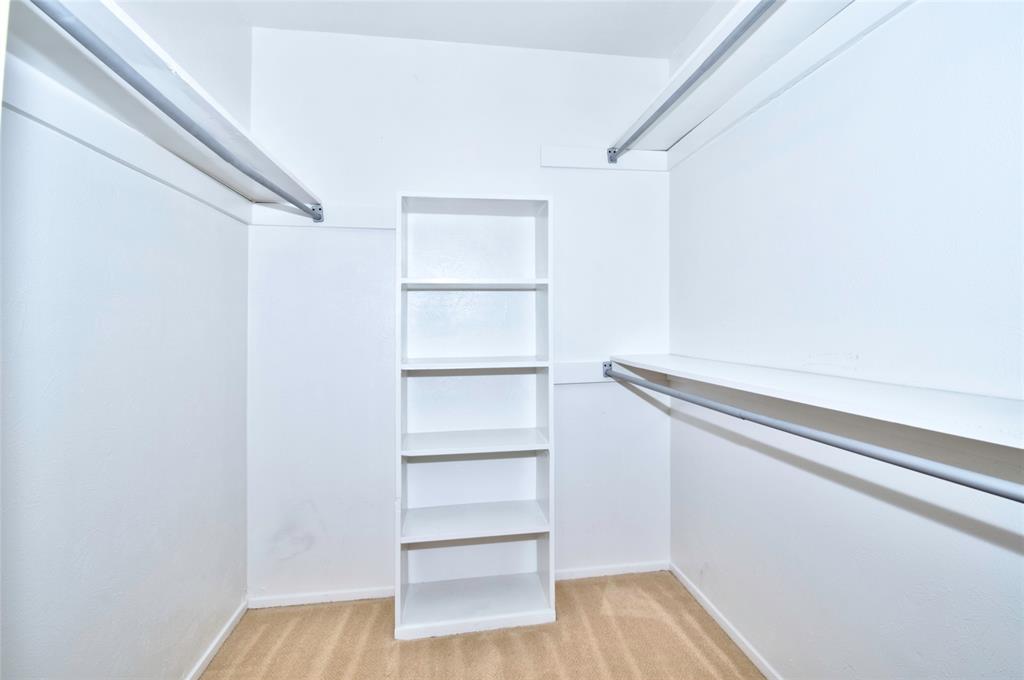 4837 Cedar Springs Road, Unit 304 Dallas, TX 75219 - Photo 12 of 32 a view of walk in closet with empty racks