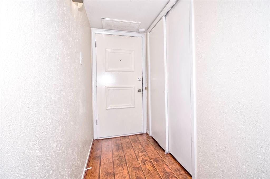 4837 Cedar Springs Road, Unit 304 Dallas, TX 75219 - Photo 13 of 32 a view of a hallway with wooden floor