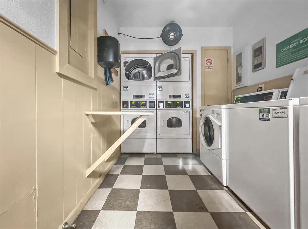 4837 Cedar Springs Road, Unit 304 Dallas, TX 75219 - Photo 18 of 32 a close view of a utility room with washer and dryer