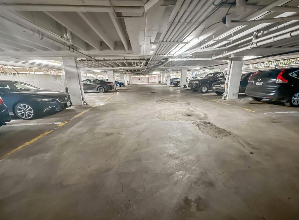 4837 Cedar Springs Road, Unit 304 Dallas, TX 75219 - Photo 21 of 32 a view of parking garage with cars