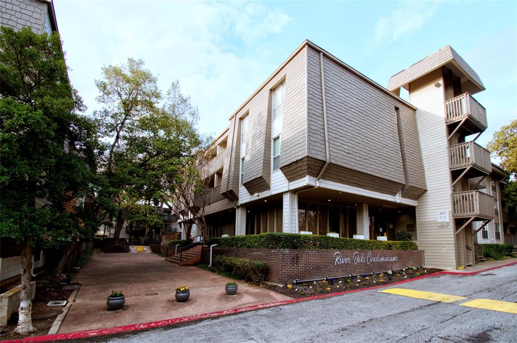 4837 Cedar Springs Road, Unit 304 Dallas, TX 75219 - Photo 25 of 32 a front view of a house with a yard