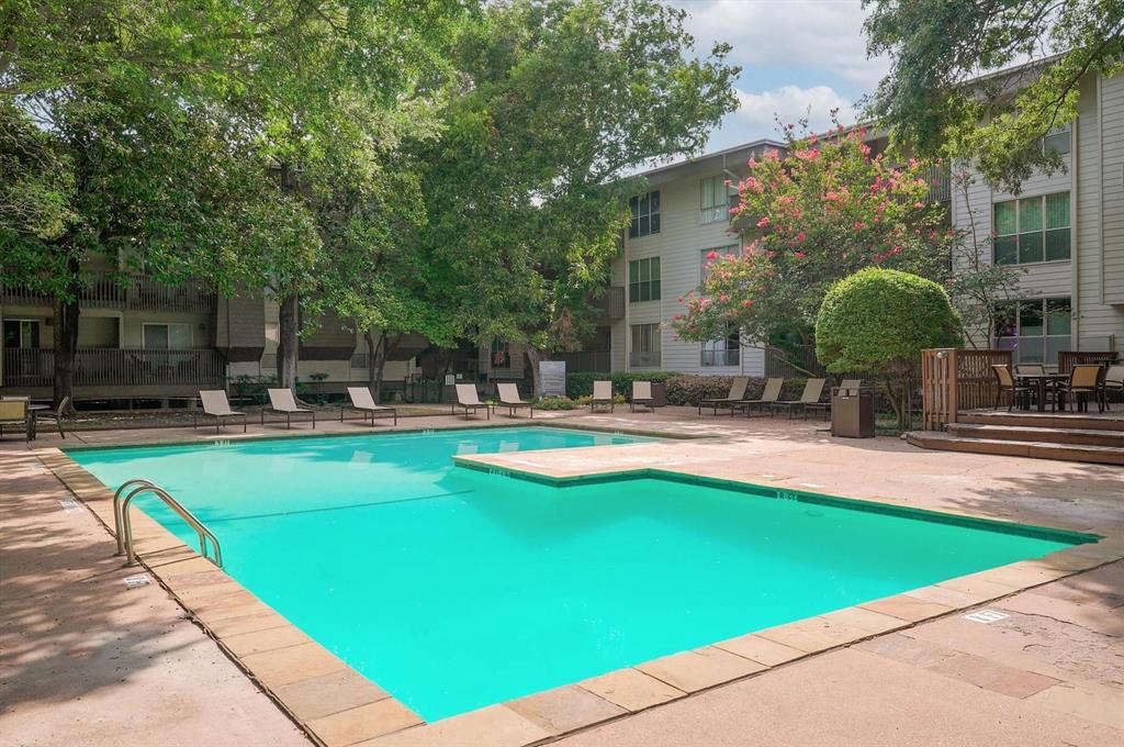 4837 Cedar Springs Road, Unit 304 Dallas, TX 75219 - Photo 30 of 32 a swimming pool with outdoor seating and yard