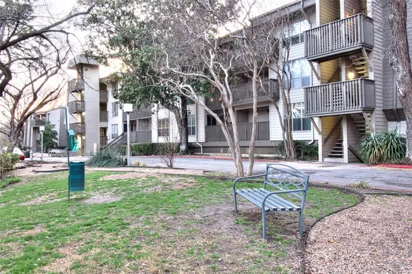 a house that has a tree in front of it