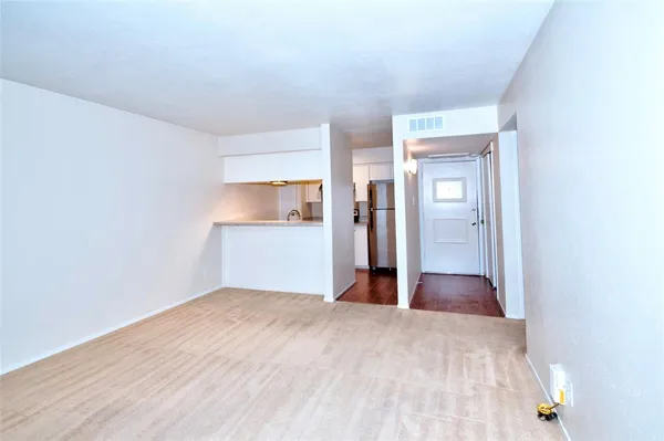 a view of wooden floor in an empty room