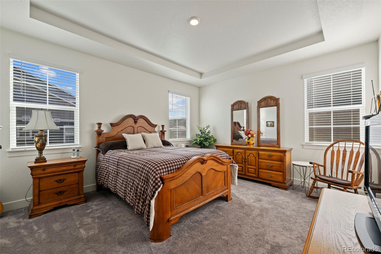 1680 Rivergate Way Berthoud, CO 80513 - Photo 17 of 41 a bedroom with bed and windows