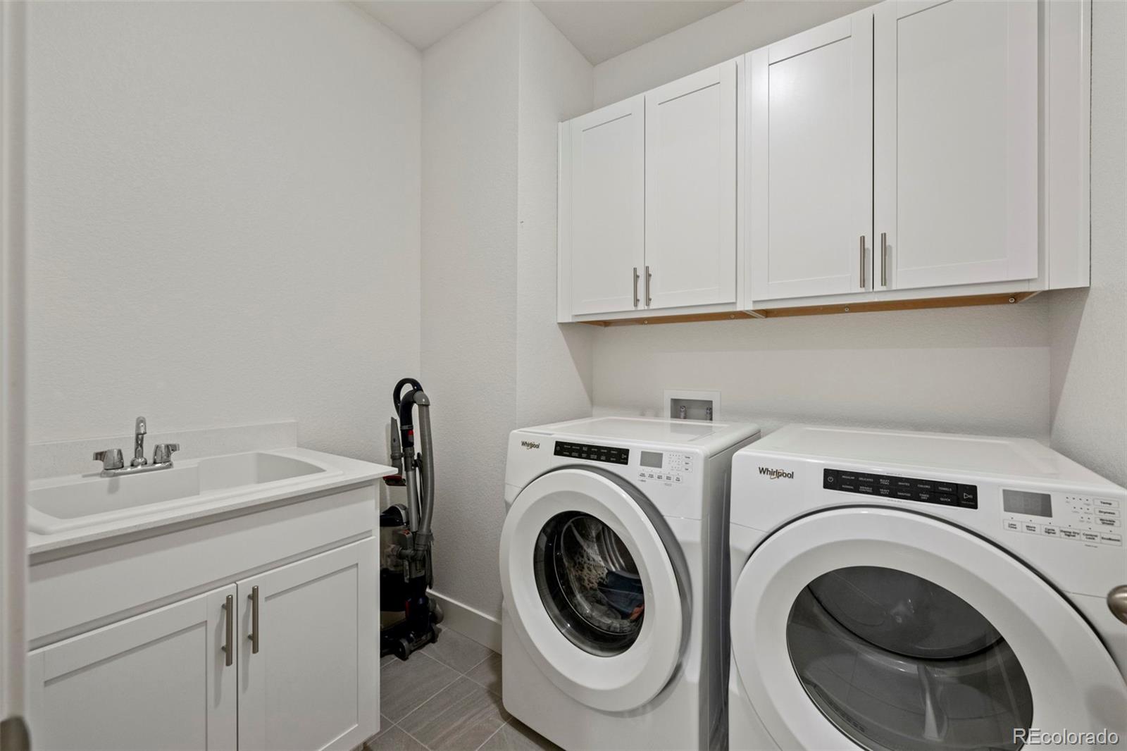 1680 Rivergate Way Berthoud, CO 80513 - Photo 20 of 41 a utility room with dryer and washer