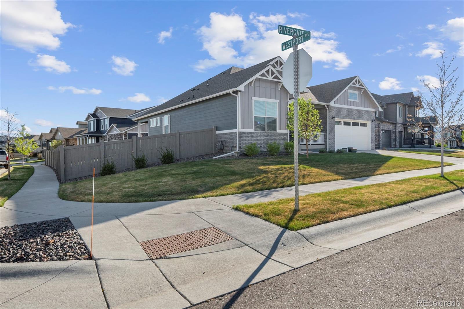 1680 Rivergate Way Berthoud, CO 80513 - Photo 2 of 41 a view of a house with a backyard and a garage