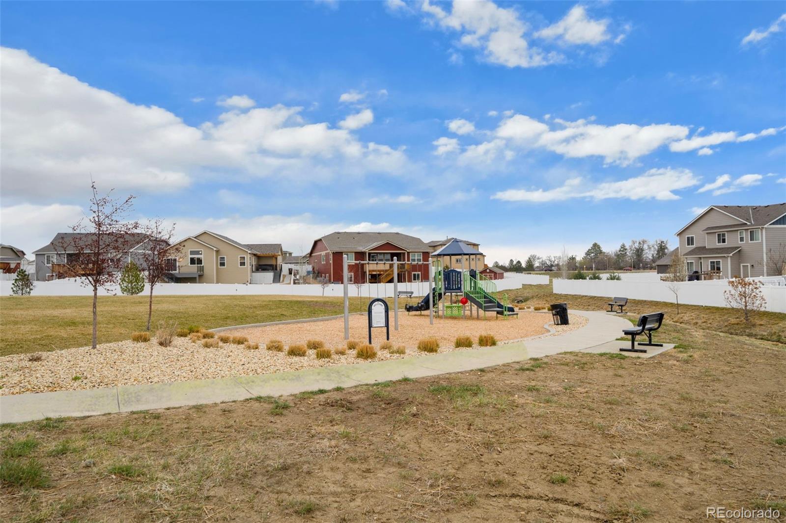 1680 Rivergate Way Berthoud, CO 80513 - Photo 26 of 41 a view of a lake with houses in the back