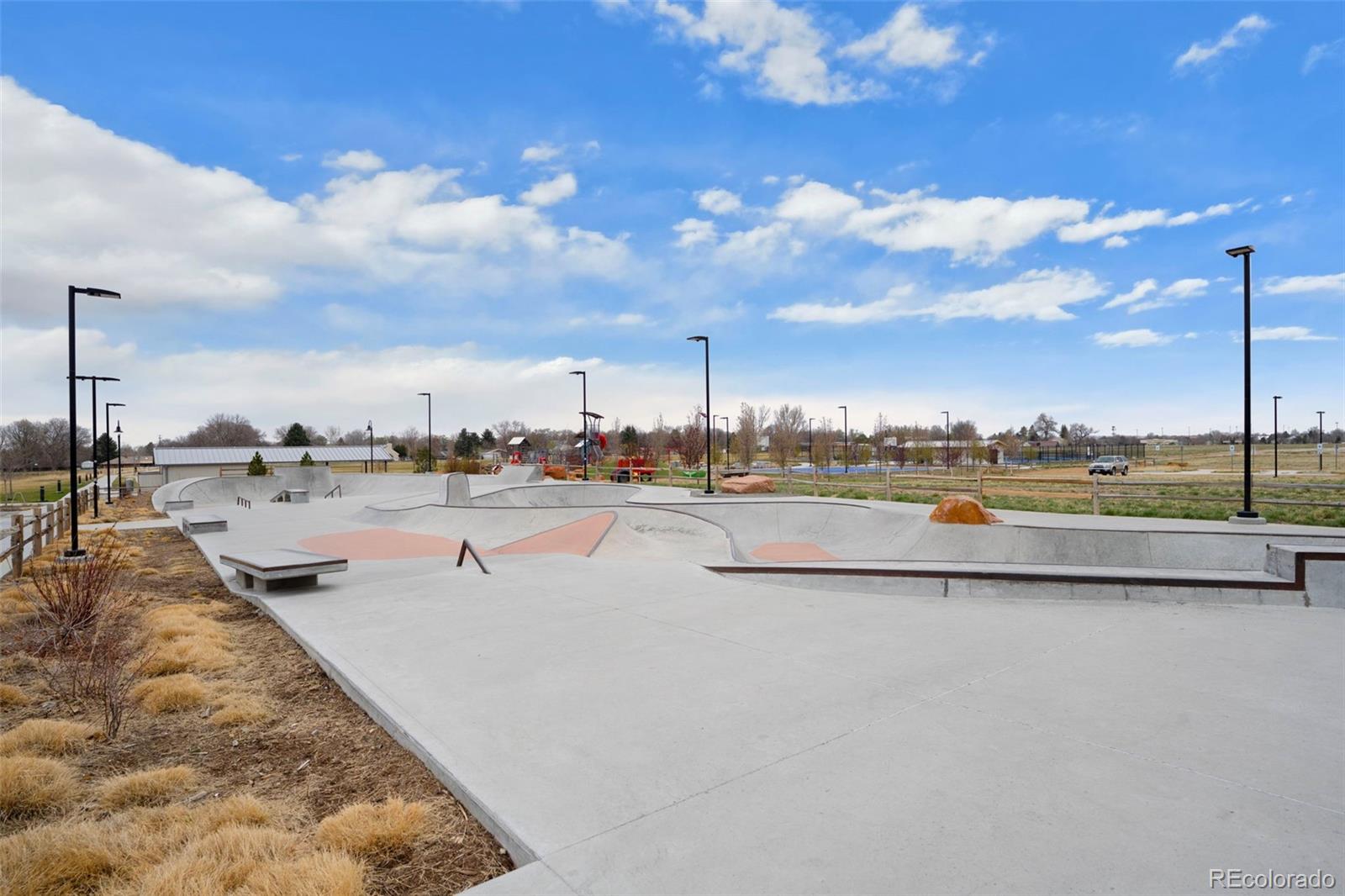 1680 Rivergate Way Berthoud, CO 80513 - Photo 33 of 41 a view of swimming pool with outdoor seating and city view