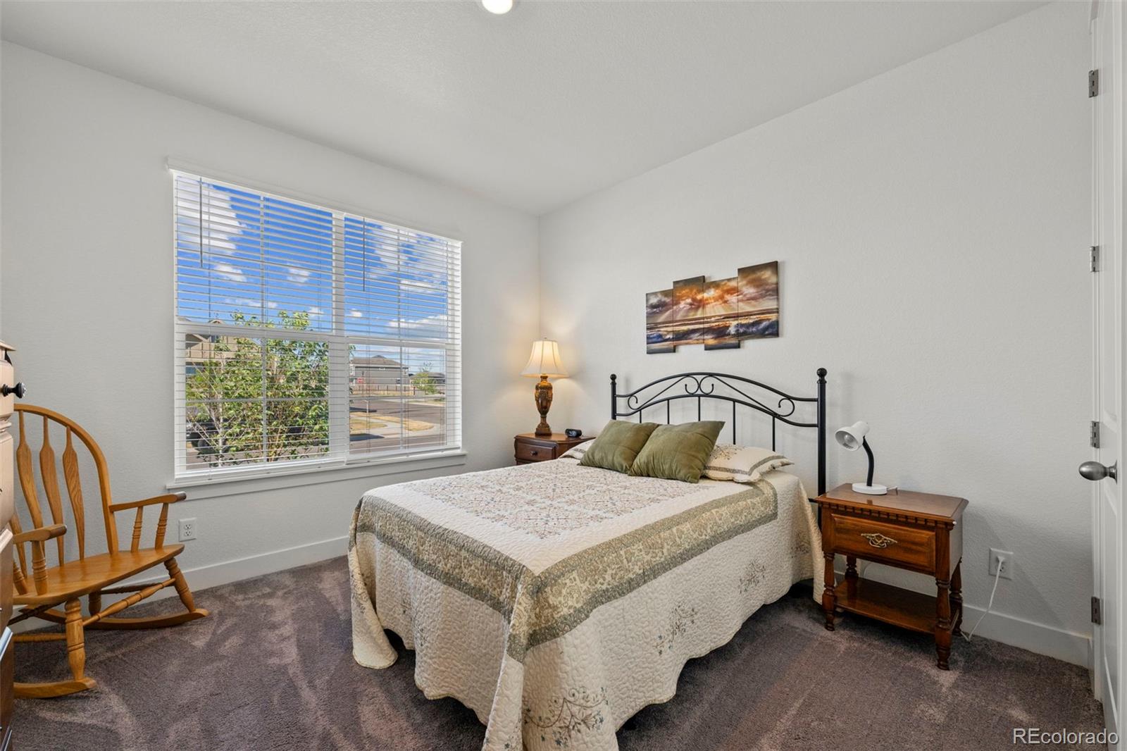 1680 Rivergate Way Berthoud, CO 80513 - Photo 5 of 41 a bedroom with a bed and a window