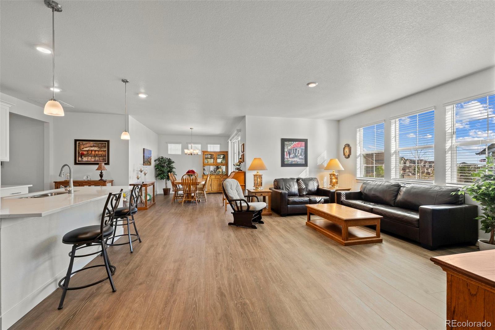 1680 Rivergate Way Berthoud, CO 80513 - Photo 10 of 41 a living room with furniture and a wooden floor