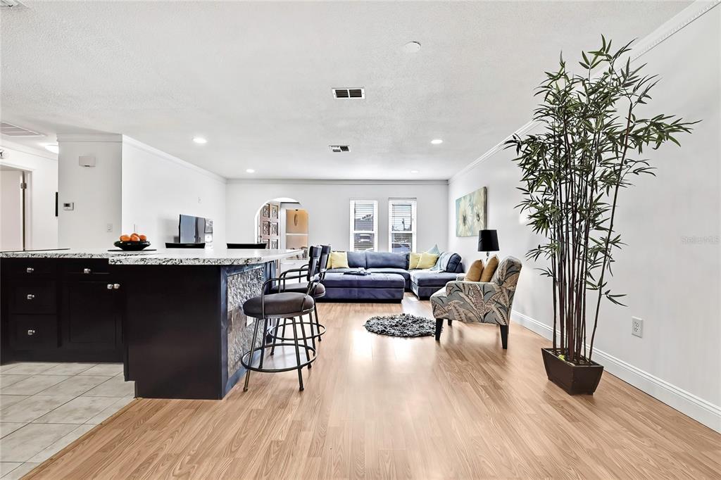 9059 Gaynor Street Spring Hill, FL 34608 - Photo 17 of 36 a living room with furniture and a wooden floor