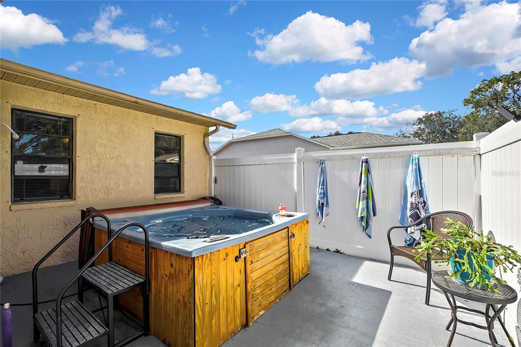 9059 Gaynor Street Spring Hill, FL 34608 - Photo 5 of 36 a view of house with backyard and sitting area