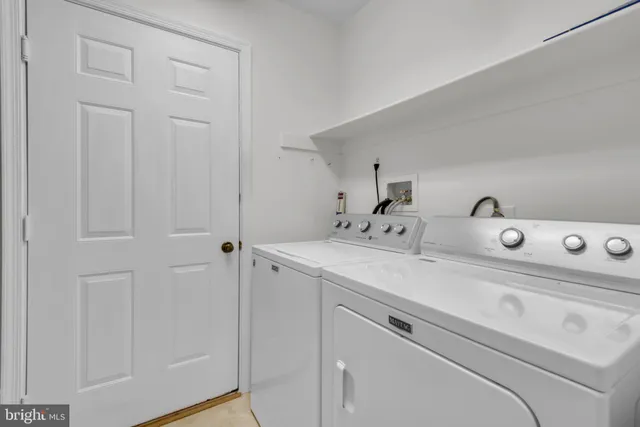a bathroom with a sink a toilet and shower curtain