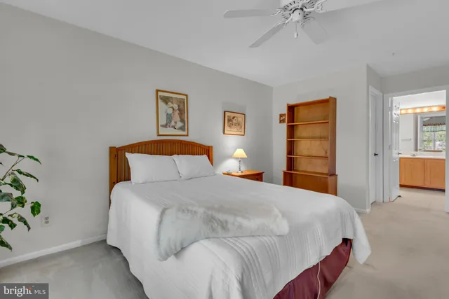 a bedroom with a bed and a television