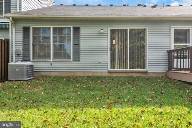 a front view of a house with a garden and yard