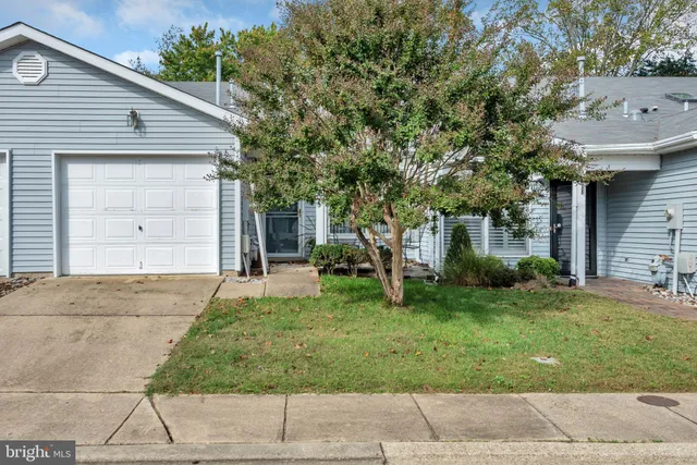 a view of a lake with a house in the background
