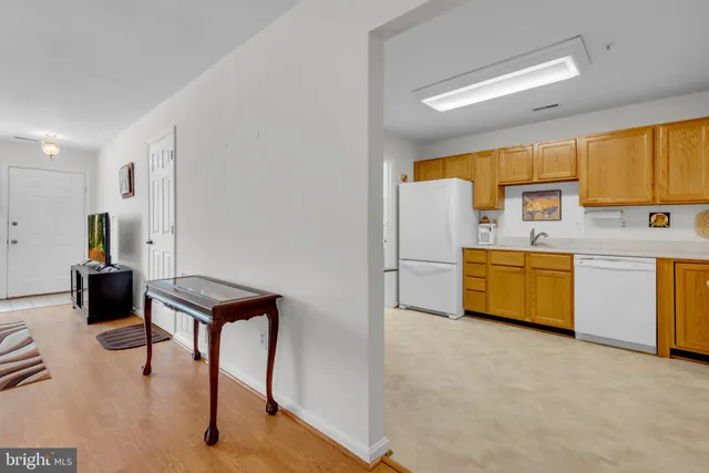 a kitchen with a sink a stove and a refrigerator