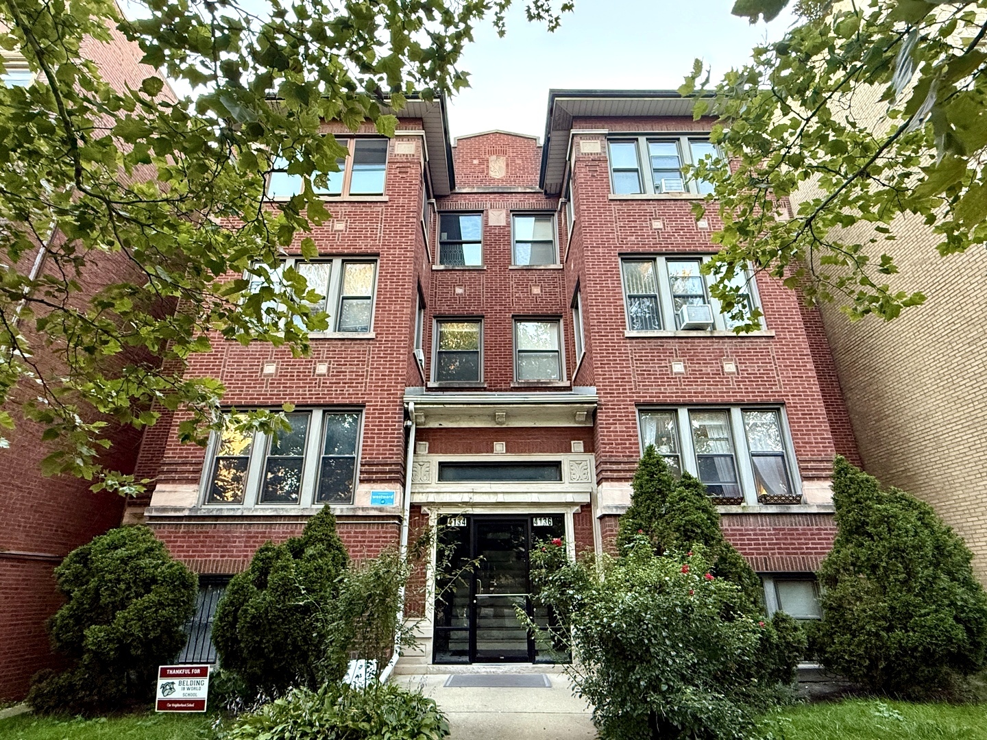 a front view of a multi story residential apartment buildings