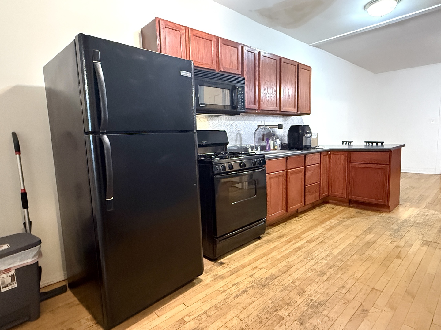 4134 North Keystone Avenue, Unit 1SW Chicago, IL 60641 - Photo 4 of 7 a kitchen with stainless steel appliances granite countertop a refrigerator and a stove top oven