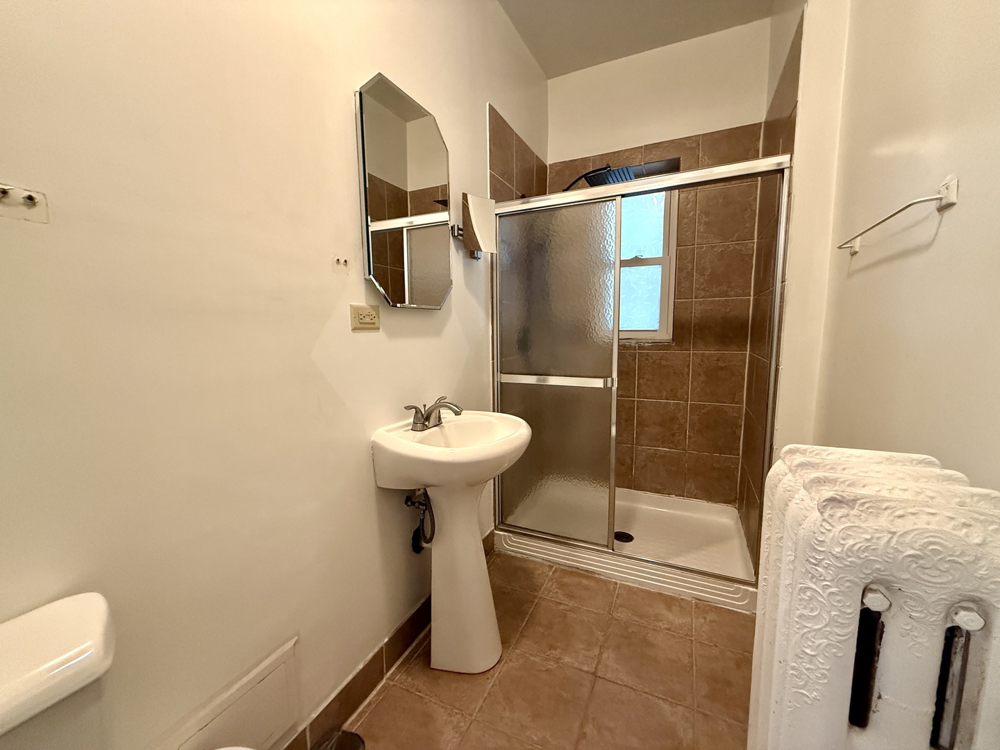 4134 North Keystone Avenue, Unit 1SW Chicago, IL 60641 - Photo 5 of 7 a bathroom with a sink toilet and shower