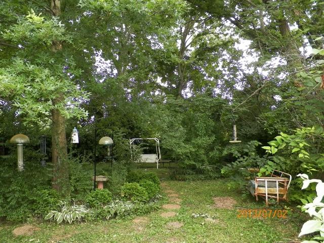 1043 Moran Road Franklin, TN 37069 - Photo 10 of 11 Enjoy the treed lot which backs up to the common area. Numerous flowers, shrubs, and trees.