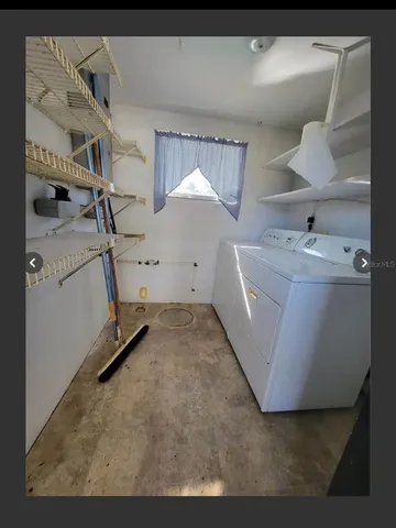 a utility room with cabinets