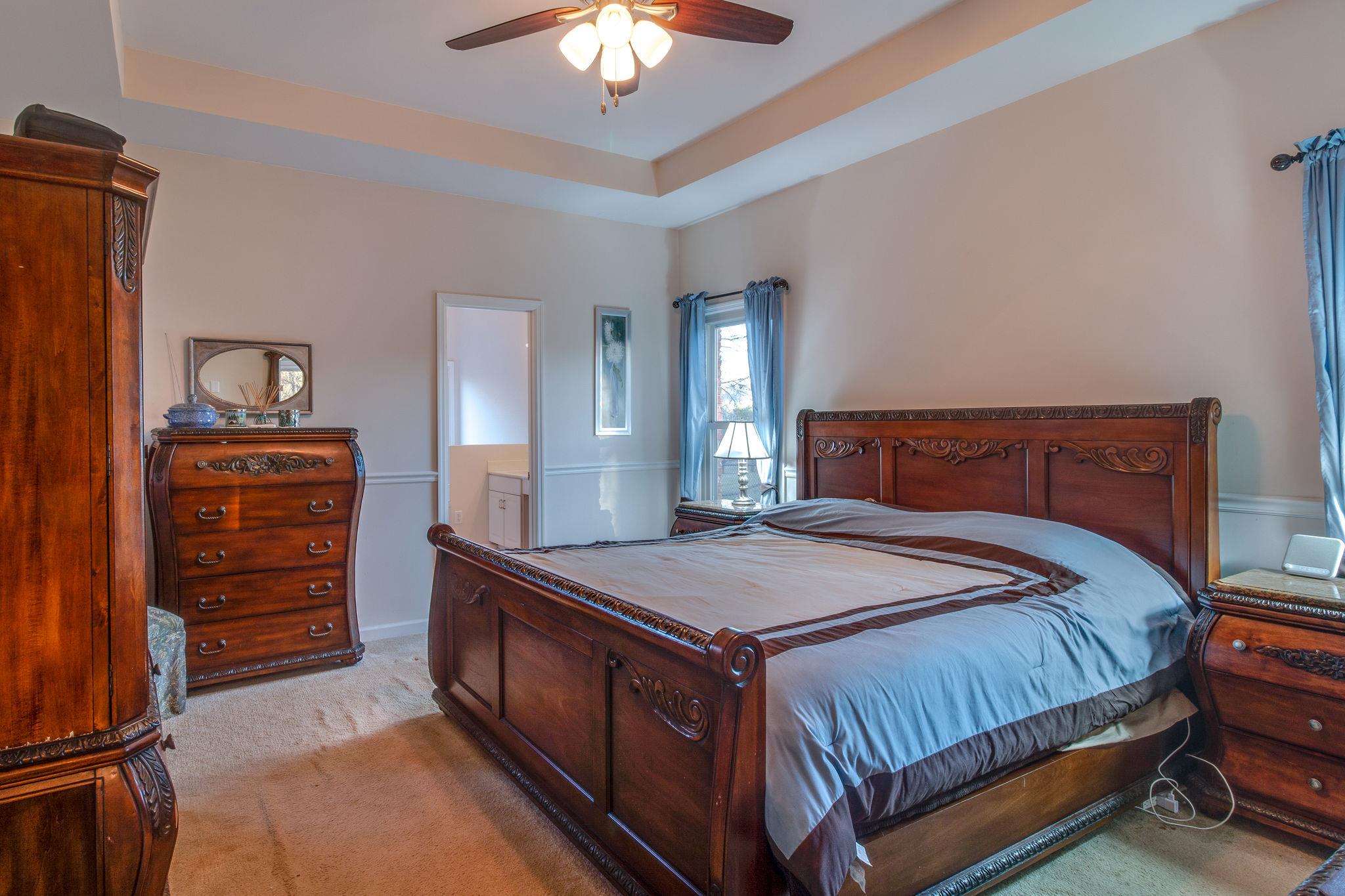 1040 Rip Steele Road Columbia, TN 38401 - Photo 14 of 25 a bedroom with a bed and a dresser