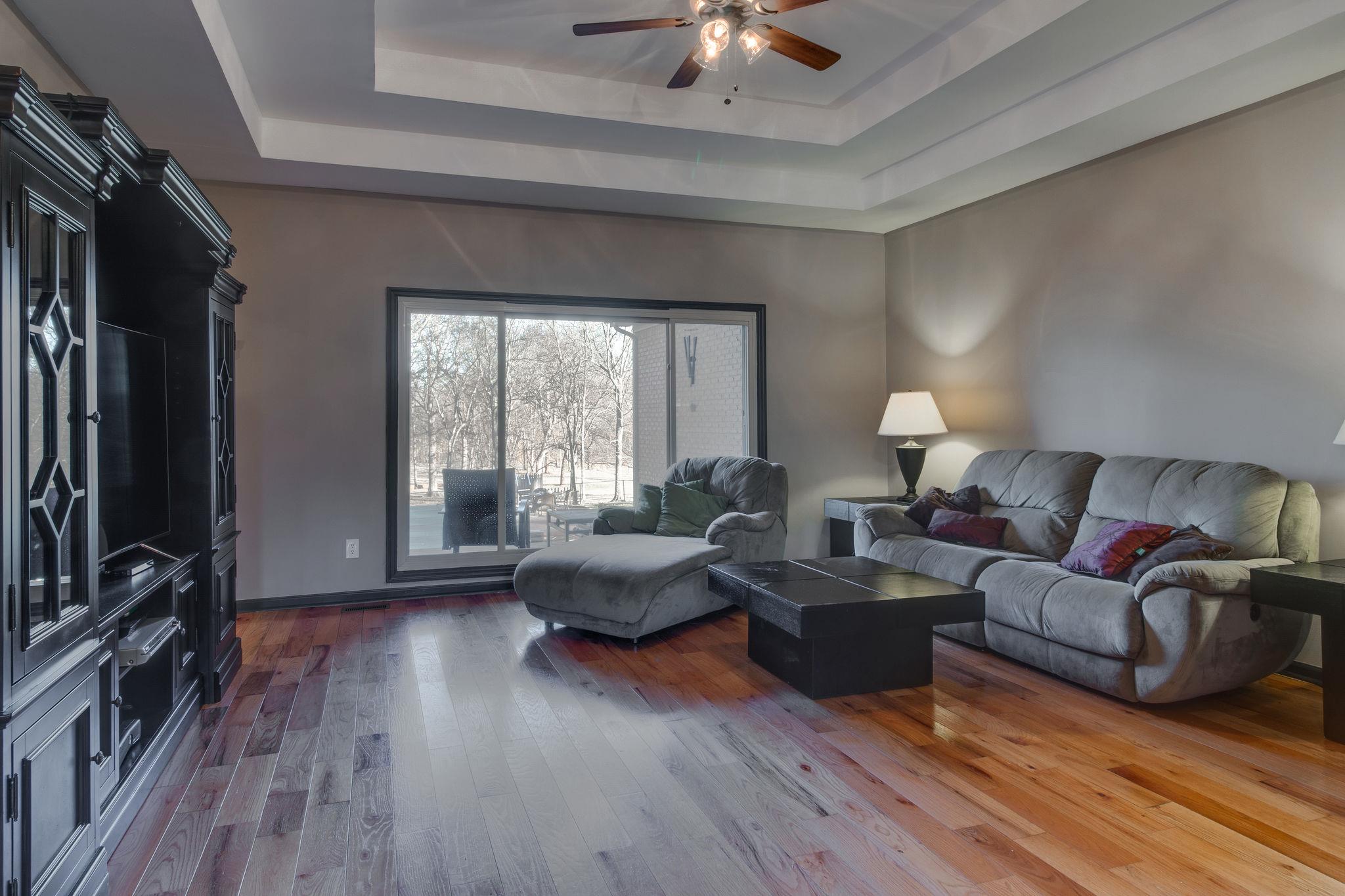 1040 Rip Steele Road Columbia, TN 38401 - Photo 4 of 25 a living room with furniture flat screen tv and hard wood flooring