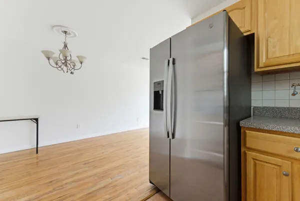 a bathroom with a granite countertop shower a sink and a stove