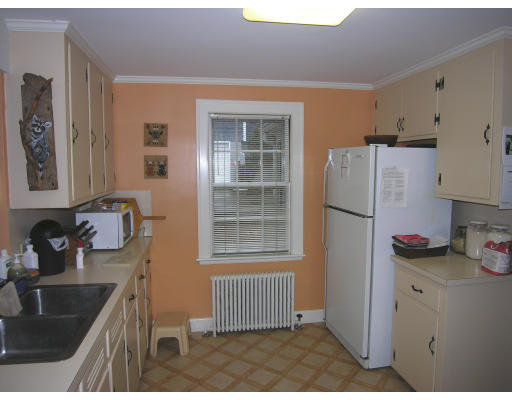 259 Hillcrest Road Needham, MA 02492 - Photo 6 of 10 a kitchen with a refrigerator and a sink