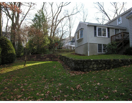 259 Hillcrest Road Needham, MA 02492 - Photo 9 of 10 a front view of a house with a yard