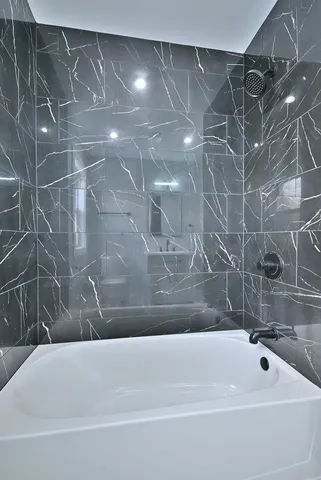 a bathroom with a bathtub