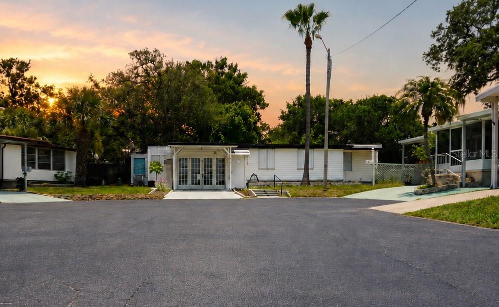 980 7th Street Northwest, Unit 71 Largo, FL 33770 - Photo 1 of 23 a view of a swimming pool with an outdoor space and seating area