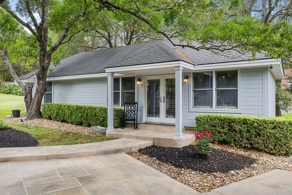 7609 Sandia Loop Austin, TX 78735 - Photo 32 of 40 The private, detached casita offers exceptional flexibility for guests or a home office, featuring its own independent entrance and a charming porch nestled among mature trees.